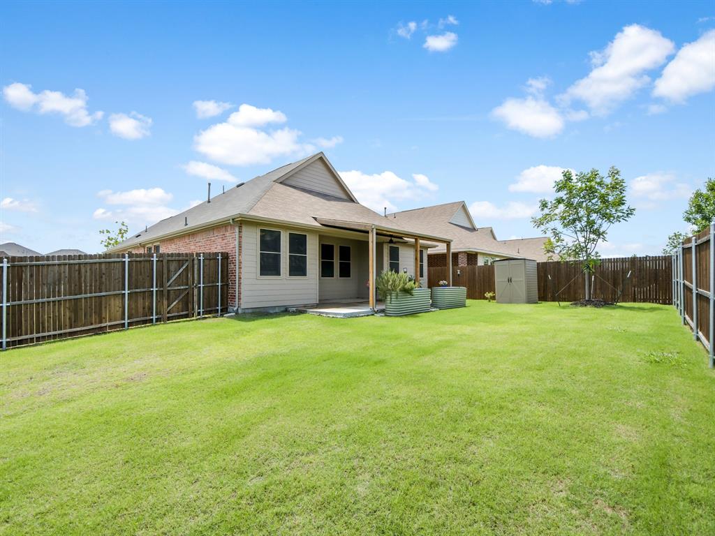 * NO PID or MUD Taxes ** BIG 24 x 16 COVERED PATIO overlooking HUGE Pool sized private backyard on the CORNER ** Barley Lived in WITH many IMPROVEMENTS ** Open-concept floorplan perfect for entertaining and everyday living * Large OPEN Dining Area * Perfectly designed SPLIT-BEDROOM layout offers privacy with 4 bedrooms separated into three distinct areas ** Designer touches throughout include PLANTATION SHUTTERS and quartz countertops  ** Neutral light-and-bright colors ** Luxury wood-like FLOORING THROUGHOUT DOWNSTAIRS only carpet upstairs (NEW 2026) ** The kitchen is equipped with a gas range and convenient motion-activated faucet ** Upstairs, enjoy an OVERSIZED 19x15 GAMEROOM ideal for a media room, playroom, home office OR EXTRA 5th BEDROOM ** The GARAGE features professional HIGH-END STORAGE cabinets and overhead shelving solutions ** Step outside to relax under the huge covered patio *Backyard SHED STAYS with Property PLUS the 2 raised garden beds are all ready for new plantings ** Residents enjoy an outstanding community with a park and playground, resort-style POOL with LAZY RIVER, covered picnic areas, fire pits, grills, and LOW HOA dues!