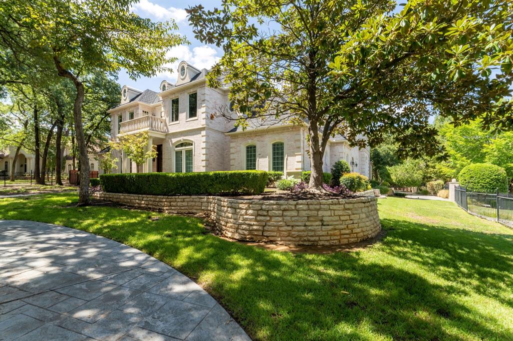 Experience this timeless custom home located in Laurelwood Park, one of Southlake’s premier neighborhood’s. Quick access to the highway you’re only a ten minute drive from DFW airport and minutes from shopping and restaurants! The timeless design of 1804 Larkspur Court boasts with intricate crown moldings, ornate columns, coffered ceilings and breathtaking architecture inside and out! A sweeping staircase frames the palatial foyer, opposite to an elegant executive office with custom shelving and a secret door that quietly takes you to the primary suite. The first primary suite overlooking the backyard is flooded with natural light with a sitting area to capture surreal moments of your achievements. Amenities include the recently updated chef's kitchen highlighted by Viking-Subzero appliances, large kitchen that flows to your living area.  The backyard has a massive 60 gallon pool and spa, outdoor kitchen, custom fire pit and basketball court. All bedrooms have ensuite bathrooms.