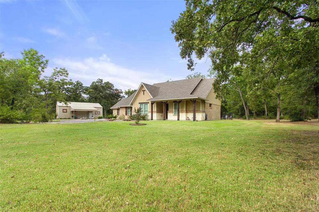 Tucked inside highly sought-after Post Oak Meadows in Crossroads ISD, this custom-built 3 bedroom, 2 bathroom home sits on approximately 5 beautifully fenced acres, offering the perfect blend of comfort, privacy, and functionality. Step inside to an inviting open floor plan with generous natural light, ideal for everyday living and entertaining. The kitchen, dining, and living spaces flow seamlessly together, creating a warm central hub for gathering. Outside, the property is set up for true country living with a productive garden area, plenty of room for animals or play, access to a shared pond, and a versatile shop that includes finished living quarters—perfect for guests, a home office, or extended family. A deep, approximately 460' water well, drilled to the same depth as the renowned Hope Springs, provides an excellent water source for the home and land. If you’ve been looking for a peaceful homestead with room to breathe, work, and grow—this one checks all the boxes.