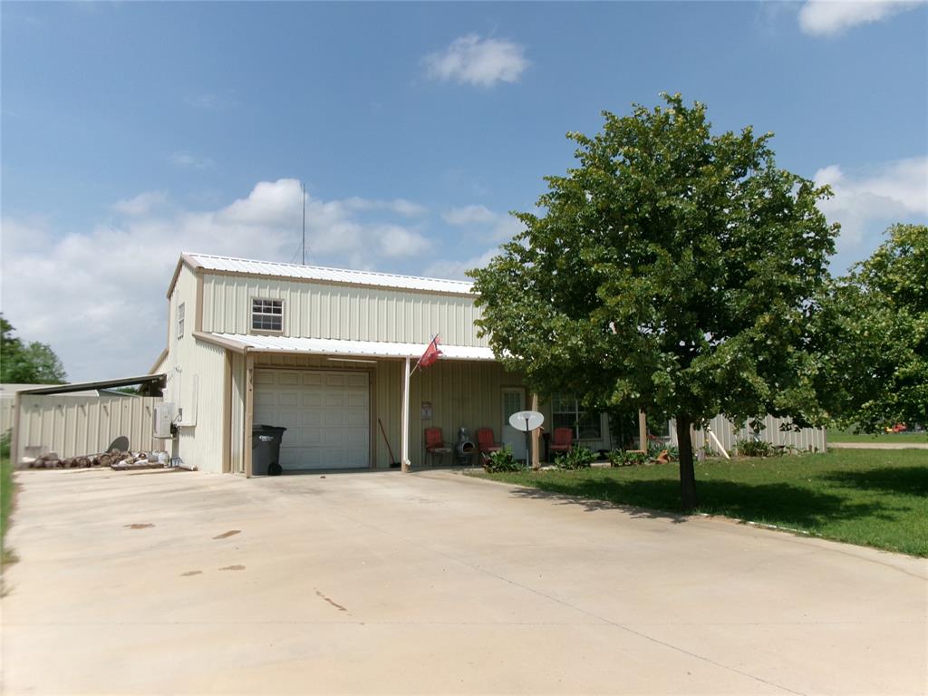 Welcome to Your Two Story Rustic Barndominium With Cedar Walls Inside Your Home. Includes Two Bedrooms And Two baths And An Insulated 800 SQ FT Plus Garage Workshop. Heating And Cooling Is Provided By Energy Efficient Mini Splits For Your Home In Three Areas And Garage Workshop. In Your Backyard Comes With Custom Metal Privacy Fencing. Home Is Located On Two Lots With Large Driveway To Park Your Boat. Holiday Villages Is A Resort Style Community With Private Boat Ramps To Use When You Go Fishing In The World Famous Lake Fork. Community Pool, Clubhouse And Lots Of Green Space For The Family To Enjoy. Hurry On By Before This One Is Gone!