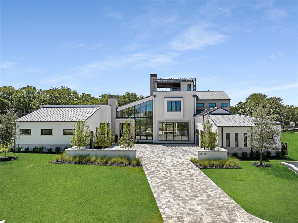 WOW FACTOR! Contemporary Home is located in the exclusive Westlake Ranch! Three story under roof home offers an elevator to third floor covered deck w fireplace & amazing views of the community! Expansive use of glass & metal doors & windows, floating wood staircase, extensive use of white oak, designer appointed natural stone features & lighting, are only some of the key features of this home! The Owner’s Retreat showcases a floor to ceiling marble fireplace wall, Spa-Like bath & shower, glass & metal doors to private courtyard. This creative floor plan presents a Game Room w Bar, Study, & Safe Room. The spectacular outdoor living features a privacy wall w fireplace, grill, green egg, pool & spa. Westlake Ranch is a carefully crafted, luxury active gated community w 3 indoor pickleball courts, green spaces, walking trails, stocked fish pond,& membership to The Clubhouse. Westlake Academy, Keller ISD & Open Enrollment to Southlake Carroll ISD! MOVE IN READY Q1 of 2025!