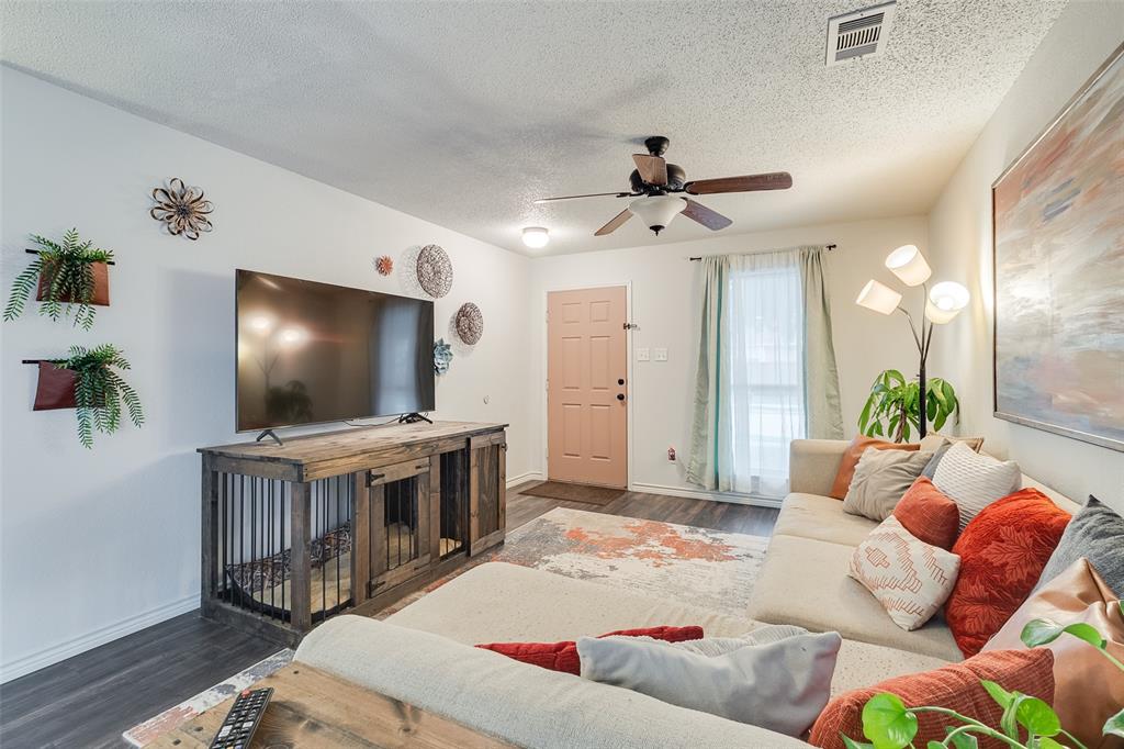 Motivated Seller! Nestled in a charming neighborhood, you'll have direct access to a 10-mile walking trail just behind the house. Additionally, the highly sought-after Little Elm Beach is only a short 5-minute drive away. This delightful half duplex boasts an open and spacious layout, seamlessly connecting the living, dining, and kitchen areas. Nice natural light! The kitchen features a convenient breakfast bar that provides additional seating & serving space. Along with matching black appliances, REFRIGERATOR included, there is ample counter and storage space. and a pretty backsplash. Retreat to the spacious master bedroom, ensuite, which has large closets. Throughout the house, you'll appreciate the 12mm newer laminate flooring, adding an elegant touch to each room. UPDATES INCLUDE new baseboards, fresh paint, fixtures, rear door, and the bathrooms feature nice tile work. The backyard has an 8-foot privacy fence offering seclusion & tranquility. The garage is finished out too!