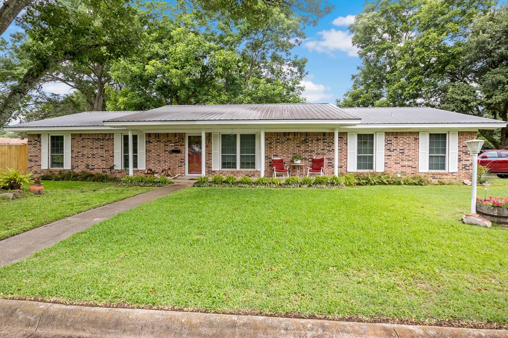 Welcome home to this charming 3-bedroom, 2-bath property nestled in a peaceful Mount Pleasant neighborhood just minutes from shopping, dining, and everyday conveniences. From the moment you step inside, you’ll appreciate the warm and inviting living space centered around a cozy wood-burning fireplace — perfect for relaxing evenings at home. The eat-in kitchen offers beautiful wood cabinetry, a breakfast bar, and plenty of space for gathering with family and friends. The private primary suite features its own ensuite bath, while two additional guest bedrooms share a well-appointed hall bath. Enjoy your morning coffee or unwind in the spacious enclosed porch overlooking the large fenced backyard, complete with a storage building for added functionality. With comfortable living spaces, thoughtful features, and a convenient location, this home is ready to welcome its next owners.
