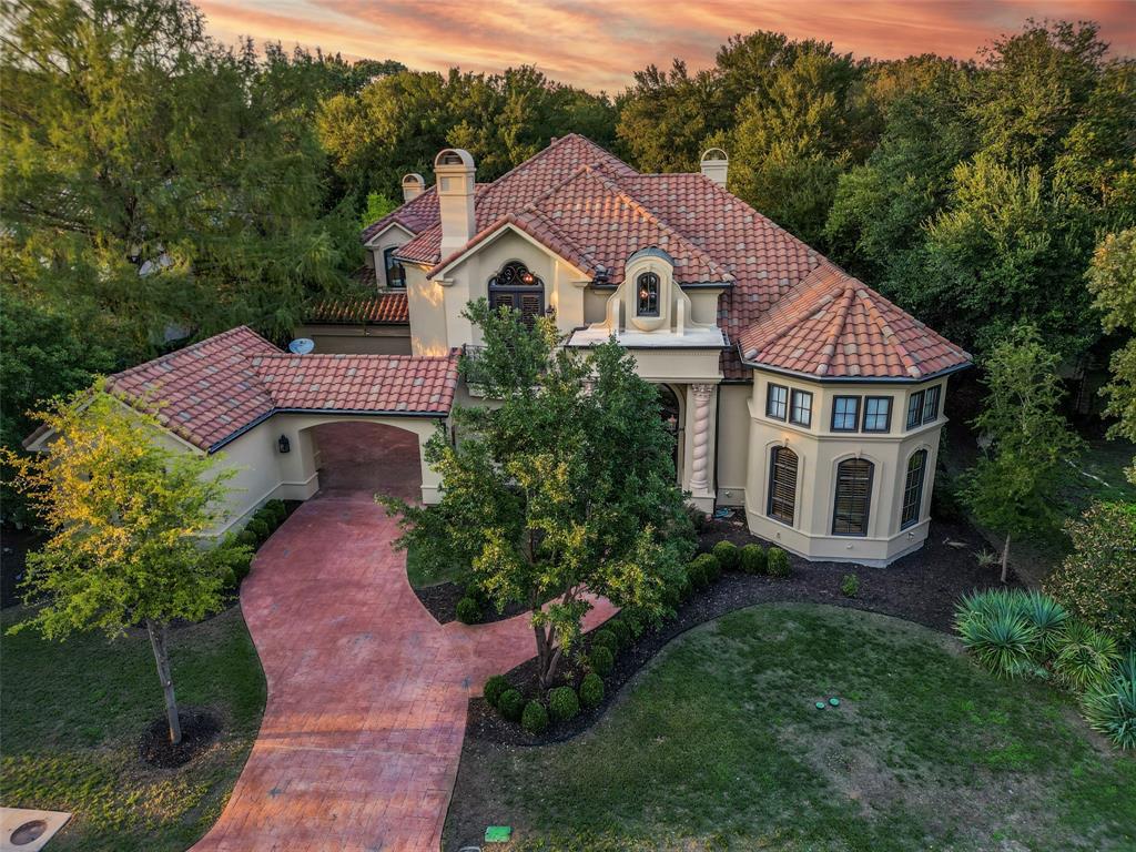 This luxurious home, nestled in the prestigious Mira Vista Country Club, offers an unparalleled living experience. Boasting 5 spacious bedrooms, each accompanied by its own private bath, and a versatile study that can easily serve as a 6th bedroom, this home is designed for both comfort and functionality.The living space is bathed in natural light, thanks to a breathtaking glass wall providing panoramic views of the lush surroundings, creating a seamless connection between indoor and outdoor living! Step outside, and you'll discover your personal oasis a heated pool and spa, complemented by a covered patio, perfect for entertaining guests or enjoying tranquil evenings by the water. The expansive yard provides ample space for outdoor activities.This home on the Street of Dreams in Mira Vista Country Club is a testament to luxury living, offering both elegance and the opportunity to bask in the natural beauty of its setting. It's a true gem for those seeking the finest in TX living.