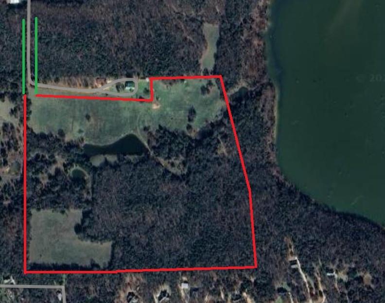 Rare Opportunity in the Mountain Springs area of Lake Ray Roberts!!  Roughly 64 acres with Corp of Engineer frontage to the lake.  Property features varying terrain with several ideal building sites for your dream estate home, mature Oak Trees, 1 large pond and 2 smaller stock tanks, open pastures for grazing or hay production, Lots of wildlife habitat, fencing, and all the privacy you could ask for!  Driveway is an improved easement from FM 922.  Mountain Springs water available, no meter present, electricity available.  Feels much larger than 64 acres due to the mix of rolling terrain, Mature treed areas and open pastures.  One of a kind property that is extremely hard to find.  Land has been owned by the current family for 60 years.  Come see this Jewel of North Texas today!