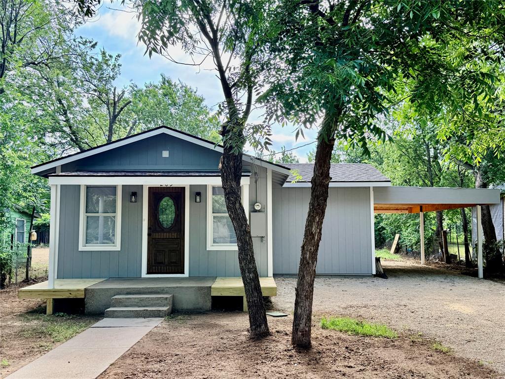 You'll be very pleasantly surprised by this recently remodeled little gem nestled in the shade trees! Stunning 2 bedroom, 1 bathroom, 1 car carport home that has been completely remodeled on the inside as well as the outside.  Move-in ready home with brand new central heat & air in 2026, brand new luxury vinyl plank flooring throughout, brand new stainless steel kitchen appliances with a 5 year warranty, brand new 30 year composition roof in 2026, fresh farmhouse gray paint both inside and outside, new windows, new plumbing fixtures, new electrical, and new washer and dryer included. The beautiful kitchen offers Granite countertops, tile backsplash, gorgeous cabinetry, under-mount stainless steel sink with garbage disposal, smooth surface electric range, built-in microwave, stainless steel refrigerator and two lazy Susans making it a breeze to cook delicious meals right at home.  Each bedroom is cozy and private with lighted ceiling fans, recessed lighting and their own closets with ample built-in shelving. The washer and dryer are conveniently located in the hallway near the bathroom.  The bathroom boasts a tub-shower combination, a vanity with Granite countertop and sink, and a toilet.  The central heat & air unit and the water heater with pan and drain line are located in a utility closet across the hall from the bathroom.  A side access door from the carport directly into the house will keep you covered during inclement weather.  Total electric home with central heat and air. Level backyard with a concrete slab ready for your future storage building. Chain-link fenced on two sides. Plenty of space for a garden or for children or pets to play.  Must see!