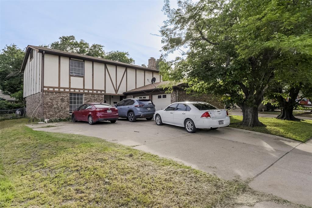 Great investment property located near schools.   Half bath downstairs - two bedrooms and full bath upstairs.     Unit B has fireplace.    Units share an undivided two car garage.     Property has upside potential to the next owner.