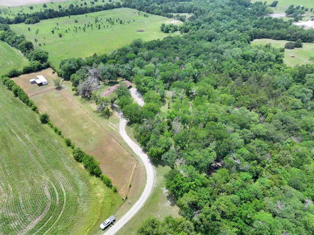 Located in the ETJ of rapidly growing Van Alstyne, 677 FM 3356 presents a unique opportunity for buyers seeking acreage with flexibility, future potential, and strategic location. Just minutes from Hwy 75 and surrounded by continued residential and commercial growth throughout the area, this approximately 5-acre property offers the increasingly rare combination of usable land, existing improvements, and fewer restrictions than many nearby properties.

Whether you're a business owner looking to live and operate from the same property, an investor searching for land in a high-growth corridor, or someone needing space for equipment, warehouses, workshops, or additional outbuildings, this property offers exceptional versatility. The level, usable acreage provides ample room for expansion, storage, livestock, business operations, or future development opportunities.

Set back from the road with a long private driveway, the property currently features a functional 3-bedroom, 3-bathroom home with a large bonus room approximately 14' x 18.5', offering immediate residential use, office potential, or flexibility for on-site operations. 

Recent updates include:

New roof and gutters on both the house and barn (2025)
Foundation repairs secured to bedrock with transferable lifetime warranty (2025)
New HVAC system (2023)
Septic Tank Flushed (2025)
Fiber internet recently installed (2025)

Properties with approximately 5 acres, an existing home, ETJ flexibility, and proximity to major growth corridors are becoming increasingly difficult to find—especially under $1M. With development expanding north along the Hwy 75 corridor, 677 FM 3356 offers the opportunity to secure usable acreage today while positioning for the future growth of the area.