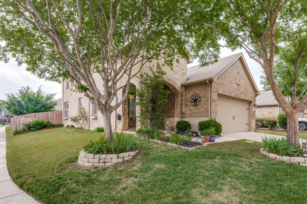 Welcome to this beautifully maintained 4 bedroom, 2.5 bath home with a 2 car garage, nestled in the highly desirable Villages of Woodland Springs Neighborhood and zoned to acclaimed Northwest ISD, with the new high school within walking distance. Located on a corner lot with generous parking. Thoughtfully designed with functionality and comfort in mind, with an open-concept layout. Upon entry, you are greeted by wood floors and brand new carpet with a nice-sized half bath and closet. The living room features barn doors, crown molding, and custom shelving. The open-concept living area flows into the kitchen, featuring additional crown molding, granite countertops, a custom island that matches the cabinetry, custom corner shelving in the dining area, and all-electric appliances. The primary suite is tucked away just off the kitchen, located in the back of the home on the 1st floor, and offers a relaxing escape. The crown molding continues in the bed and bathroom. It offers a garden tub with a separate shower,  a custom cabinet above the toilet, and additional shelving and hanging space in the generous primary walk in closet. Outside the primary, a large linen closet. A well-positioned utility room, complete with a custom counter for folding, and an additional hanging rod that extends the length of the room for those line-dry items. Also located outside of the utility room is an additional linen closet. The upstairs has a nice-sized game room with three bedrooms just off that area. The bathroom has been updated with a shower glass installed. One bedroom has wood flooring, and the other two are carpeted. The house has fresh paint throughout the inside in neutral colors.  Enjoy a 10x10 patio with room to expand,  and a nice-sized backyard with charming landscaping. This property is located in a vibrant community offering 6 pools, a playground, several catch and release ponds, miles of scenic bike and jogging trails, volleyball courts, and a tennis-pickleball court