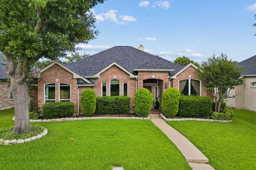 Beloved four-bedroom home in Allen ISD offers a fantastic floorplan. The drive-up appeal of this Shadow Lakes charmer reflects the care poured into the home. Stone-bordered front beds with vibrant shrubbery and mature trees welcome you home. Step inside to find easy care tile flooring that flows into the kitchen and nook. Off the entry find a spacious room that can serve as a second living room or a dining room with direct access to the kitchen. Across from this space is one of the 4 bedrooms in the home that is currently used as a home office. The family room boasts a high ceiling adding to the spacious feel and windows overlooking the back patio. Open to the nook and the kitchen, this space gives nice flow for entertaining or evenings in. The kitchen provides abundant counter space and storage. Find 42in cabinets, nice size island with butcher block counter plus storage and a pantry. Gas cooktop, composite sink and black appliances round out the kitchen. The primary is a lovely retreat with laminate flooring, great natural light, walk-in closet and updated en suite bath.  The spa-like bath offers quartz countertops with white cabinetry and an oversized walk in shower. The secondary bedrooms are a nice size. The guest bath is also updated with quartz countertop and white cabinetry providing good storage. Step out back and enjoy outdoor living. The property boasts a prolific vegetable garden along with herbs and tomatoes. Storage shed for gardening implements will convey with the home. New roof and chimney 2025. Exterior lighting with timers added along front of the home in 2025. Walk to Shadowlakes Park! Enjoy all that Allen has to offer including Watters Crossing, shops, dining and easy access to major thoroughfares. Don’t miss this opportunity! SEE AGENT FOR BUYER DECORATING ALLOWANCE!