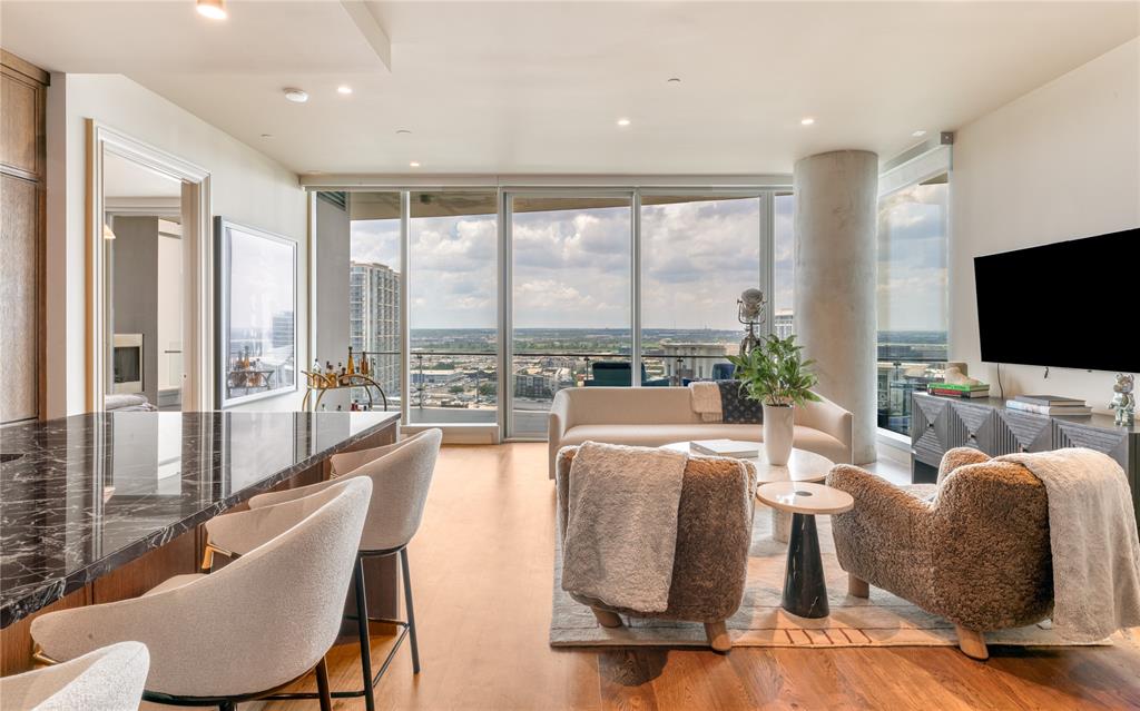 Luxury FULLY FURNISHED residence now offered at $1,299,000 in the iconic Bleu Ciel. Located at 3130 N Harwood St #1502, this designer-curated 2-bedroom, 2.5-bath home by Joshua Bernard showcases elevated, bespoke interiors with striking Rosso Levanto marble, moody Moroccan clay walls, and timeless custom finishes throughout. Appointed entirely with Waterworks fixtures and hardware, every detail reflects refined craftsmanship and sophisticated design.

Floor-to-ceiling windows flood the residence with natural light while framing sweeping city views. The open-concept living and dining spaces flow seamlessly into a sleek chef’s kitchen designed for both effortless entertaining and everyday luxury. Both spacious bedrooms feature en-suite baths, complemented by an elegant powder bath for guests.

Residents of Bleu Ciel enjoy world-class amenities including 24-hour concierge and valet, resort-style pool, state-of-the-art fitness center, spa and sauna, wine lounge, and beautifully designed common areas. Perfectly positioned in the prestigious Harwood District with walkable access to premier dining, luxury shopping, and the Katy Trail.

A rare opportunity to own lock-and-leave sophistication in one of Dallas’ most sought-after luxury high-rise residences.