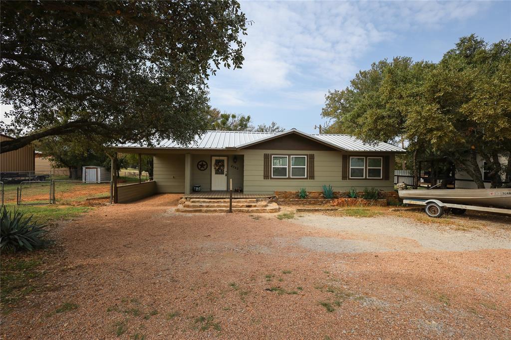 TWO BEDROOM , 1 FULL BATH AND   1 HALF BATH COMPLETELY REMODELED ,NEW FLOORS, NEW METAL ROOF, NEW  PAINT INSIDE AND OUT . ALL NEW WINDOWS AND SHUTTERS, NEW CENTRAL AIR AND HEAT UNIT .NEW LARGE BACK POTCH,  NEW DOORS , LIGHT FIXTURES, CEILING FANS AND DISHWASHER.   ALL PLUMBING AND ELECTIC WAS UPDATED. LOCATED JUST MINUTES FROM LAKE BROWNWOOD. COMMUNITY SWIMMING POOL JUST UP STREET. EXCELLENT NEIGHBORHOOD. BE A GREAT WEEKEND  GETAWAY  PLACE OR PERMANENT RESIDENCY.  YOU CAN BE ON THE WATER IN JUST MINUTES OR IN COMMUNITY SWIMMING POOL WITH A LARGE POPULATION OF DEER HANGING OUT IN THE FRONT AND BACK YARD MAKES THIS A GREAT PLACE TO JUST TO SIT BACK AND RELAX BIG PRICE REDUCTION!!!