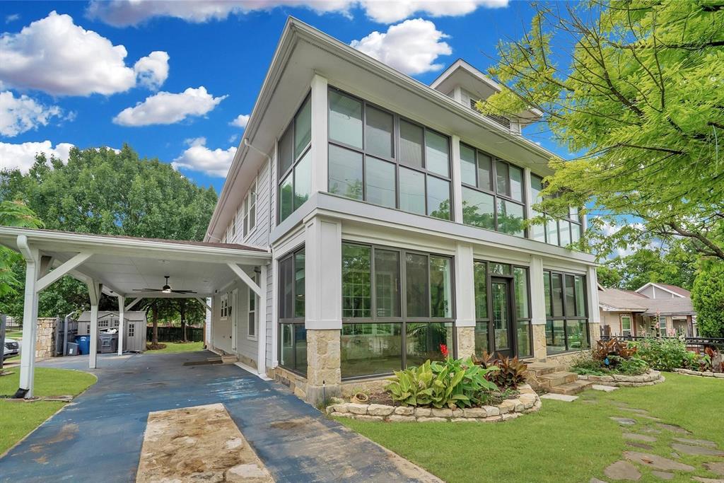 Welcome to a rare East Dallas gem where timeless charm meets an effortless lifestyle. Set on a prominent corner lot at 6303 E Grand Ave, this character-rich residence offers a front-row seat to one of the area’s most beloved settings—just steps from Tenison Park Golf Course and moments from the scenic Santa Fe Trail leading to White Rock Lake.
From morning walks beneath mature trees to afternoons on the course or weekends exploring the vibrant grounds of the Dallas Arboretum and Botanical Garden, this location invites you to embrace the outdoors while remaining minutes from the charm of Lakewood and the energy of Downtown.
Inside, classic architecture is paired with thoughtful functionality. A sizable kitchen anchors the home, offering ample space for gathering and everyday living. Dual primary bedrooms—one on the main level and one upstairs—provide flexibility for multi-generational living or private guest accommodations. Two enclosed front sunrooms are filled with natural light, creating inviting spaces for morning coffee, creative work, or a lush indoor garden.
The expansive corner lot is fully gated with two electric entry points, offering both privacy and convenience. The large backyard is designed for relaxation and retreat, complete with a spa and sauna—your own private escape at home. A charming wraparound porch welcomes you home, creating the perfect place to enjoy morning coffee, greet neighbors, or unwind in the evening while taking in the neighborhood’s mature trees and inviting atmosphere.
Zoned to the highly regarded Woodrow Wilson High School and just minutes from several award-winning charter school options, the location adds even more long-term value.
With its distinctive presence, rare indoor-outdoor versatility, and proximity to some of Dallas’ most iconic destinations, this home delivers more than a place to live—it offers a lifestyle rooted in beauty, recreation, and everyday ease.