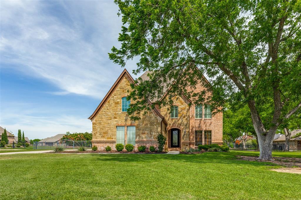 Welcome to your immaculate custom-built retreat, perfectly situated on a full acre in the gated community of The Orchards on Eagle Mountain Lake. This stunning home blends timeless craftsmanship with modern luxury, offering hand-scraped hardwood floors, triple crown molding, custom paint finishes, detailed ironwork, and a richly appointed study.
The heart of the home is the elegant living area, where soaring ceilings and a stone fireplace create an inviting space for gatherings. The chef’s kitchen is a showpiece of its own—featuring Jenn-Air appliances, a 6-burner gas cooktop, built-in refrigerator, large island, butler’s pantry, and thoughtful design throughout.
Your primary suite is a true sanctuary with a private sitting area, jetted tub, and a dream closet. Each additional bedroom includes its own private bathroom, offering comfort and privacy for family and guests. Upstairs, enjoy a dedicated media room and spacious game room—perfect for movie nights and entertaining.
Step outside to your private oasis with mature pecan trees providing shade, and a sparkling pool and spa ready for summer days. The property includes a 1,000-gallon storage tank and both a side-entry 2-car garage and an additional front-entry 1-car garage.
Residents of The Orchards on Eagle Mountain Lake enjoy exclusive access to a private sandy beach, boat ramp, docks, and pavilion—ideal for weekends on the water.
Luxury, privacy, and lake-community living come together beautifully in this exceptional custom home.