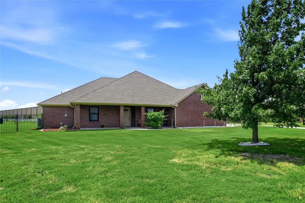 Beautiful home on a beautiful lot. This is a one owner home that was built in 2008 and has been treated with TLC and is very well maintained. This property is in a great location in the Northwest School District. 1.1 acres with lawn sprinkler system. Maple trees, 3 pecan trees, 2 peach trees and a plum tree with water system built in. Grapes, blackberries and a garden space. Electric wrought iron and brick gate enclosing the back yard and workshop. Workshop has drive-through overhead doors, heating and air conditioning, half bath and a covered parking or patio attached. Owner is leaving riding mower for lawn care and tv in workshop.