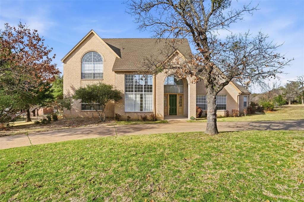 Welcome to your new home in prestigious Bent Oaks, where timeless elegance meets modern comfort on a sprawling one-acre lot with stately circular drive. Step through the front door to discover a formal living room bathed in natural sunlight from floor-to-ceiling windows, complemented by rich wood floors that add a sense of luxury & refinement. The formal dining room, perfectly situated for hosting memorable dinners, features graceful transitions into the gourmet kitchen and the inviting main living areas. The sunken living room creates an intimate, cozy atmosphere, anchored by a classic wood-burning fireplace—ideal for gathering around on chilly evenings. Oversized windows provide panoramic views of the lush grounds & flood the space with serene, natural light throughout the day. The chef’s kitchen is a true centerpiece, boasting an expansive island, abundant custom cabinetry, a spacious eat-in nook, and open sight lines for effortless entertaining. Whether preparing daily meals or hosting lively gatherings, this kitchen is designed for both function and style. Downstairs, thoughtful layout continues with full bath & versatile room that can serve as home office, guest suite, or creative studio, along with an additional full bath & a flexible bedroom area perfect for multigenerational living or accommodating guests. Ascend the staircase to the impressive primary suite—a private sanctuary featuring a spa-inspired bathroom with a luxurious garden tub, separate glass-enclosed shower, dual vanities, two oversized walk-in closets, sophisticated tilework, and soaring windows that invite the outdoors in. Step outside to envision your own outdoor paradise: the expansive backyard offers limitless possibilities for a custom pool, outdoor kitchen, fire pit, or peaceful garden retreat. This is a rare opportunity to own a residence that blends elegance, functionality, & perfect setting for making lasting memories.