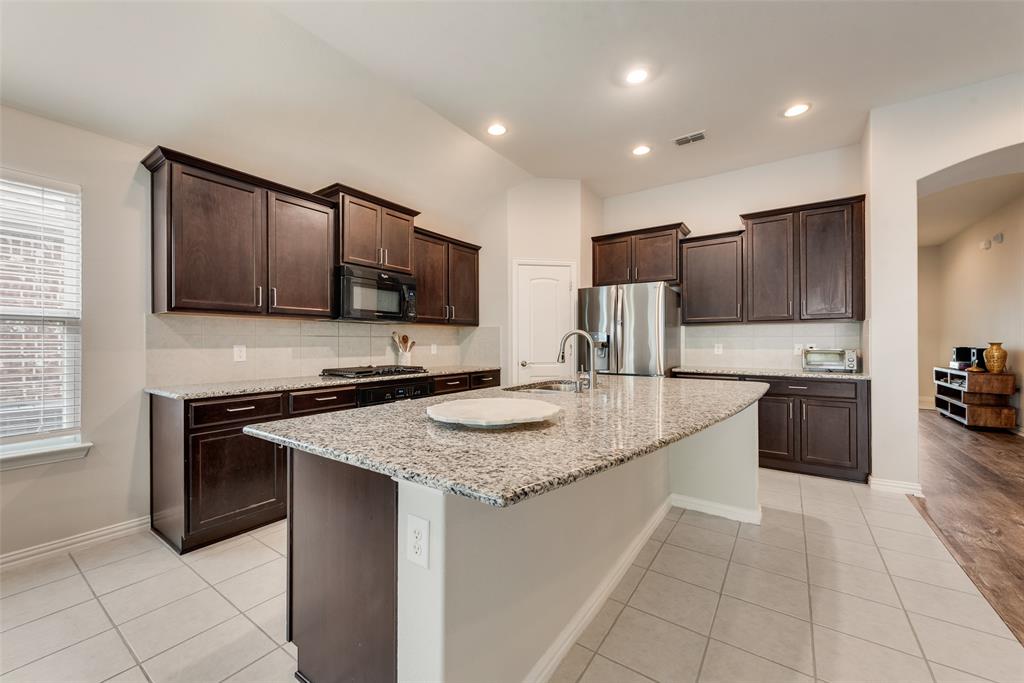 Well maintained and thoughtfully designed, this Canyon Falls home in Northlake offers an inviting open layout, stylish updates, and access to a community known for its natural beauty, recreation, and everyday convenience. New luxury vinyl plank flooring flows through the entry, living room, and primary bedroom, creating a fresh, cohesive feel from the moment you step inside. The spacious kitchen serves as the heart of the home with granite countertops, tile flooring, a gas cooktop, walk-in pantry, and a large island overlooking the living room for easy connection while cooking, hosting, or relaxing. Natural light fills the living area, and the adjacent study nook provides a practical spot for work, schoolwork, or daily planning. The large primary bedroom offers an airy retreat with abundant natural light and an ensuite bath featuring beautiful ceramic tile floors, a remodeled shower with a seamless glass door, a separate tub, and a walk-in closet designed for standout storage. The closet includes a built-in modular system and conveniently connects directly to the laundry room. A mudroom off the garage adds function with a large utility closet for added organization. HOA dues include front lawn mowing, 500 Mb internet, and DirecTV, adding valuable ease to daily living. Canyon Falls enhances the lifestyle with Graham Branch Creek Preserve, offering 200 acres of natural open space, oak hammocks, upland habitat, wetlands, trailheads, gathering spaces, and a dog park, all connected by paved and natural trails. Residents can also enjoy additional open space, ponds for catch-and-release fishing, swimming pools, a splash pad, playgrounds, Canyon Falls Club with a fitness center, and a robust lifestyle program. Located within highly rated Northwest ISD, this home blends comfort, smart design, and exceptional community amenities in a sought-after Northlake setting.
