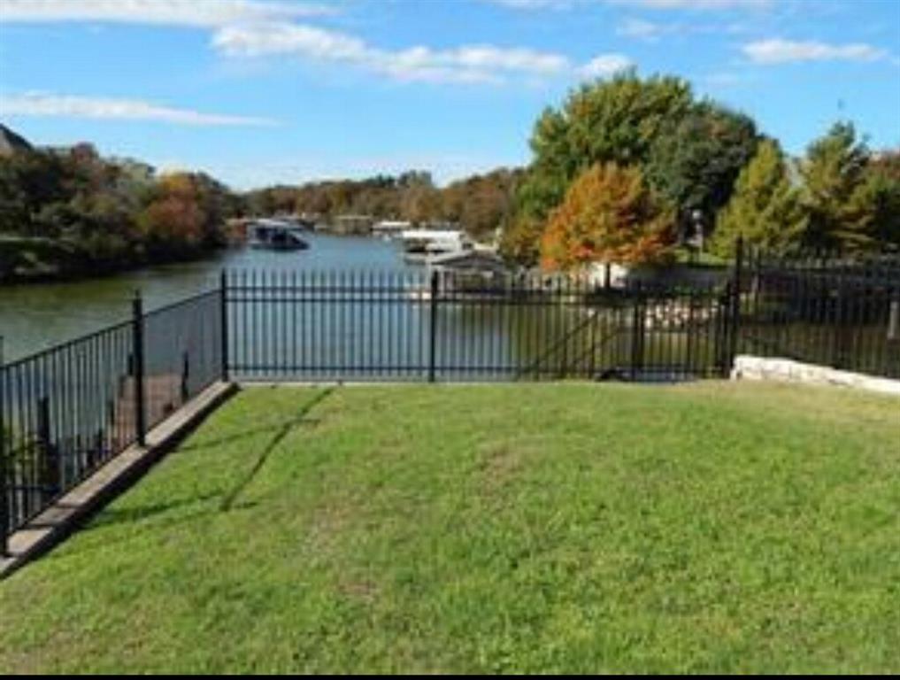 Waterfront lot on Eagle Mountain lake with fishing dock. Gated community inside the prestigious Lake Country Estates. Incredible Eagle Mountain - Saginaw school district plus Lake Country Christian academy just down the street. Last waterfront lot left in Sunset Cove on the south end of Eagle Mountain. How wonderful to sit on your future back porch and simply gaze at the lake in the secluded cove. Lake frontage for Jet Ski Platforms. Personal Boat can be covered and parked near by. Best View (Sunsets) Wow! Unobstructed Straight Down the Waterfront in all of Sunset Cove Gated Community! This lot has quick access to the dam, watersports, lakefront restaurants, and fishing. Small gated walkway pier leads to the property from the water. Minimum sq ft is between 2600-3100 sq ft. See deed restrictions for more details. Fabulous Sunsets. Stunning area. Great views straight down the channel cove. Swim platform for 2 jet skis. Small neighborhood of only 13 homes. Let the stress of the day melt away. Build your dream home. Seller has preliminary plans drawn and upstairs balcony will capture all the beauty of the waterfront.