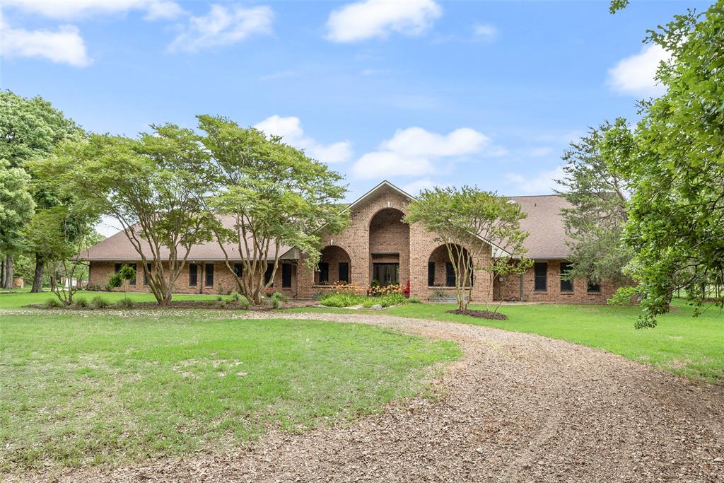 Experience ultimate privacy on this stunning 78-acre East Texas ranch, perfectly situated just 35 minutes east of Rockwall and just south of Greenville. Located at the end of a quiet county road, a long, tree-lined driveway leads you nearly a quarter-mile back to a sprawling 4,000+ sq. ft. traditional estate designed for multi-generational living or private family retreat. The main residence boasts 5 spacious bedrooms and 4.5 baths, characterized by vaulted ceilings, two living and dining areas, wet bar, and multiple office spaces. The home also features an oversized garage with space for five vehicles, built-in workbench, and extensive storage. Above the garage, you'll find a full 3-bedroom guest apartment featuring its own private entrance, kitchen, and living area, providing space for guests or rental income. For the equestrian or hobby farmer, the land is a dream. The property features highly sought-after sandy soil and has a proven history of producing two quality hay cuttings per season. The 6-stall horse barn comes complete with a tack room, hay storage, feed room, and an outdoor arena with improved footing and lights. The acreage is thoughtfully divided into cross-fenced pastures utilizing a mix of pipe, coated wire, and wire fence. A large, established tank provides a reliable water source for livestock and local wildlife. The large hay barn provides storage, additional covered trailer or RV parking, workshop space with electric, or potentially space for more horse stalls. Unwind on the covered porches or in the shade of mature trees in the beautifully landscaped backyard. Located just minutes from the recreation at Lake Tawakoni and within easy reach of grocery and restaurants, this estate offers a rare hidden feel while still a manageable drive to the city. Whether you are looking for a turnkey equestrian facility, a weekend oasis, or a peaceful family compound, this property delivers on every front. High-end country living at its finest.