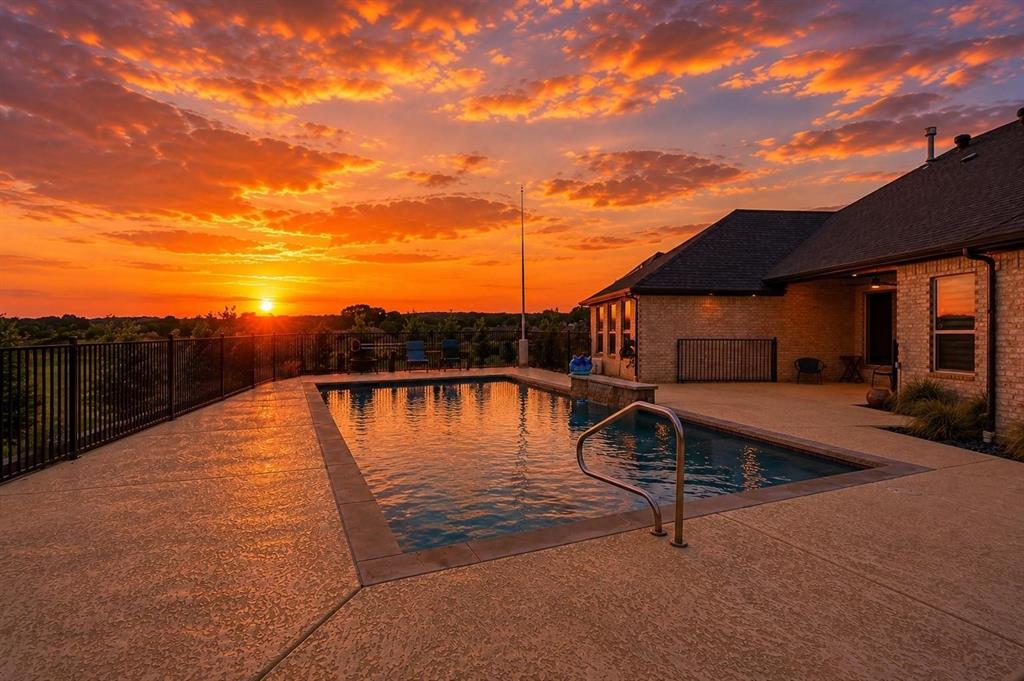 *BRAND NEW PERGOLA INSTALLED with another one on its way* Summer is around the corner & it's time to relax by the pool & take in the gorgeous views from this stunning Couto home! Situated on an elevated lot & over an acre in size, this four bedroom, three bath home PLUS Office ( or 5th Bedroom) AND Media Room offers an open floor plan, over $12k in custom window coverings, beautiful stone fireplace, granite countertops throughout & much more! As you enter the home, you are greeted with a beautiful iron door entry, coffered ceilings in the living room, stone fireplace & wall of windows overlooking the Texas landscape. The kitchen is a chef's dream with a BOSCH high end cooktop, 6 month old Kitchen Aid true convection double ovens & air fryer, 6 month old Kitchen Aid dishwasher, plenty of cabinets for storage & large breakfast bar. The master bedroom is spacious & the master bath has stunning, modern tile work surrounding the large soaker tub & walk-in shower. Enjoy your summer days outside underneath the BRAND NEW PERGOLA, listening to the waterfall or take a dip in the pool to cool off from the Texas heat! Stunning NEW landscaping plus other updates in store!