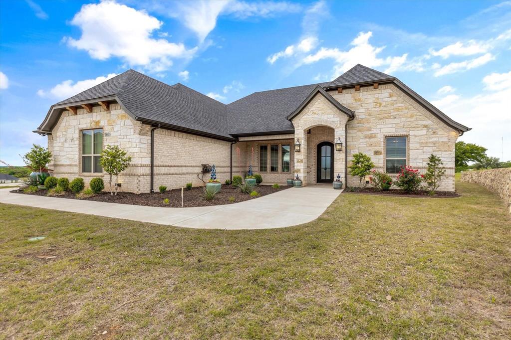 Summer is around the corner & it's time to relax by the pool & take in the gorgeous views from this stunning Couto home! Situated on an elevated lot & over an acre in size, this four bedroom, three bath home PLUS Office ( or 5th Bedroom) AND Media Room offers an open floor plan, over $12k in custom window coverings, beautiful stone fireplace, granite countertops throughout & much more! As you enter the home, you are greeted with a beautiful iron door entry, coffered ceilings in the living room, stone fireplace & wall of windows overlooking the Texas landscape. The kitchen is a chef's dream with a BOSCH high end cooktop, 6 month old Kitchen Aid true convection double ovens & air fryer, 6 month old Kitchen Aid dishwasher, plenty of cabinets for storage & large breakfast bar. The master bedroom is spacious & the master bath has stunning, modern tile work surrounding the large soaker tub & walk-in shower. Enjoy your summer days outside on the covered back patio listening to the waterfall or take a dip in the pool to cool off from the Texas heat!