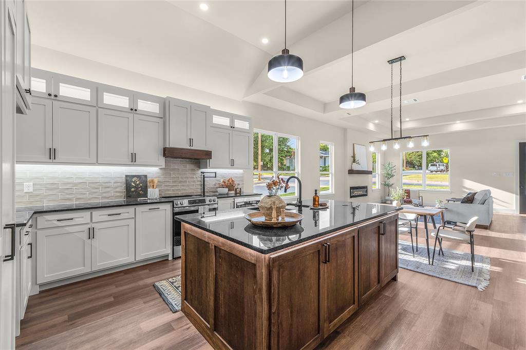 Brand-new construction featuring 3 bedrooms, 2 bathrooms, and a 2-car garage with tall ceilings, all situated on a corner lot just minutes from Texas Wesleyan University and downtown Fort Worth. This spacious home offers soaring 12-foot ceilings throughout and an open, airy layout designed for both comfort and style.

The custom kitchen is the centerpiece of the home, complete with a massive walk-in pantry that provides exceptional storage and functionality. While technically a 3-bedroom, the generous floor plan makes every room feel expansive. Specialty lighting throughout adds a modern custom touch, creating a warm and elegant atmosphere from the moment you walk in.
