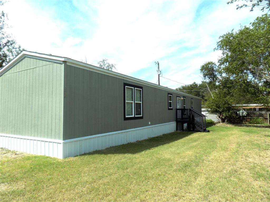 THIS HOME MEETS A MULTITUDE OF FINANCING POSSIBILITIES: FHA, VA, USDA, CONVENTIONAL, AND CASH. And Owner says IT'S GOTTA GO.  He's throwing in a double-door stainless steel refrigerator with ice maker, along with washer and dryer.  All you have to do is sign and close. Compare to new built, low mileage, 2023 high-end home. Easy to maintain and mow lot; nicely painted decks with vented steel skirting, with easy under carriage access doors.  Low HOA dues; community center, 3 boat ramps 2 play grounds, and community pool located a street away. Home features wood looking linoleum throughout, no carpet to deal with, decorative beams and trim in living room along with shelf for flat TV, decorative can lights, and as an added treat, a must have in Texas, new ceiling fans in every bedroom.  Don't forget about the new decorative blinds sure to help on the electric bill, in addition to the freebies.  Home comes equipped with stainless steel stove and dishwasher, as well. Wonderful open flow throughout.  Don't let this one get away: come take her for a test drive TODAY, you won't be disappointed.