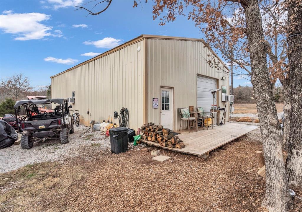 8.57 acres located near Amon G Carter Lake in the Silver Lakes Ranch community (a master-planned community with 2300 acres of rolling hills and woods)!!  On a paved culdesac sits this 30 x 50 oversized insulated metal shop with a large 400 sq ft loft, a standard permitted septic system, RV hookup and meter on-site.  The shop provides electric, water, some of the highest speed internet in the area, and a 8 inch slab to support a car lift. There are lush trees throughout the 8.57 acre property with some spots already cleared ready for building. The direct access off 1125 makes it a quick drive to the town of Bowie and 287.  Must see POA Amenties that include a community dock, community pool, playgrounds, fitness center, club house, and boat launch.  Country living just outside the city is waiting for you.