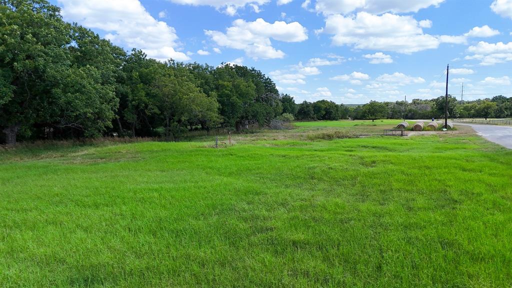 This peaceful property features a mix of open space, native trees, and a seasonal dry creek—offering the ideal canvas for your dream home or weekend retreat. With light deed restrictions (1,400 sq. ft. minimum build) and access to community perks like a stocked pond and park, you'll enjoy both freedom and recreation. Conveniently located just 10 minutes to Meridian, 15 to Hico, 25 to Glen Rose, and under an hour to Stephenville, Granbury, and Waco—rural living has never been so accessible.