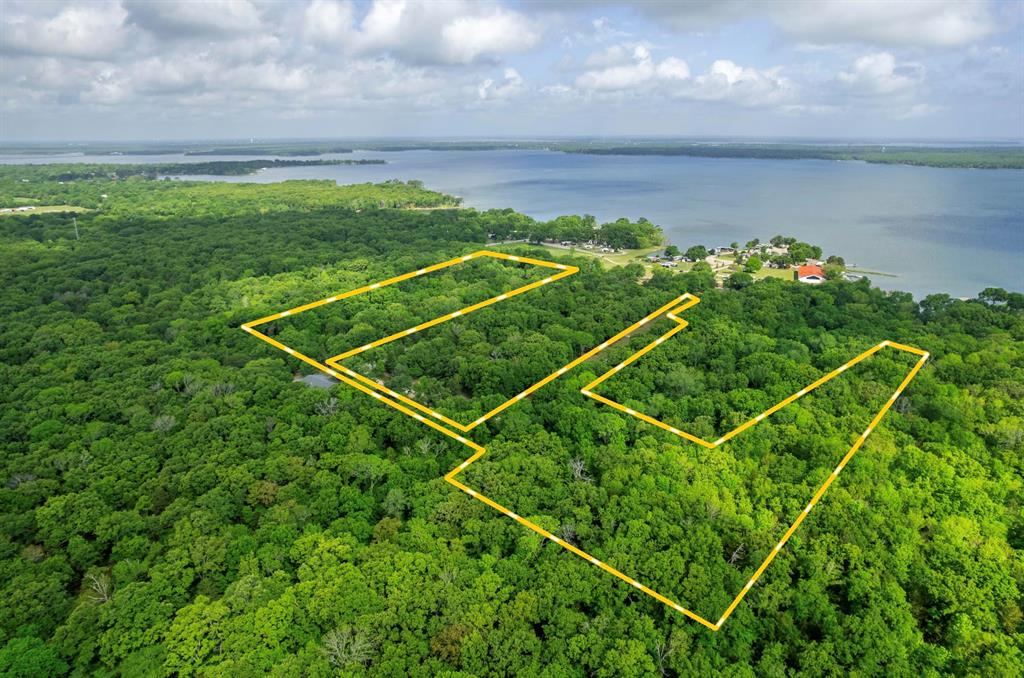 Located in Hunt County near Wills Point, Texas, this 20.54 acre property offers scenic lake views and excellent access to outdoor recreation. Overlooking Lake Tawakoni, a 37,000 acre lake known for catfish, bass, and crappie fishing, this tract is well suited for a homesite, weekend retreat, or investment.

The property includes approximately 500 feet of road frontage with private road access, providing both convenience and a quiet setting. Electricity and water are available, making it ready for future development. The land offers multiple potential build sites with elevated views toward the lake.

A public boat ramp is located just 2 miles away, allowing for quick access to fishing and boating. Lake Tawakoni State Park is also nearby and features a fishing pond, hiking and biking trails, campsites, cabins, and a four lane boat ramp.

The property is just south of Greenville and about one hour from the Dallas area, offering a balance of rural setting and accessibility. With its location, available utilities, and proximity to Lake Tawakoni, this 20.54 acre tract presents a strong opportunity for residential or recreational use in a growing area of North Texas.

Portion of the property is located in 100 year floodplain.