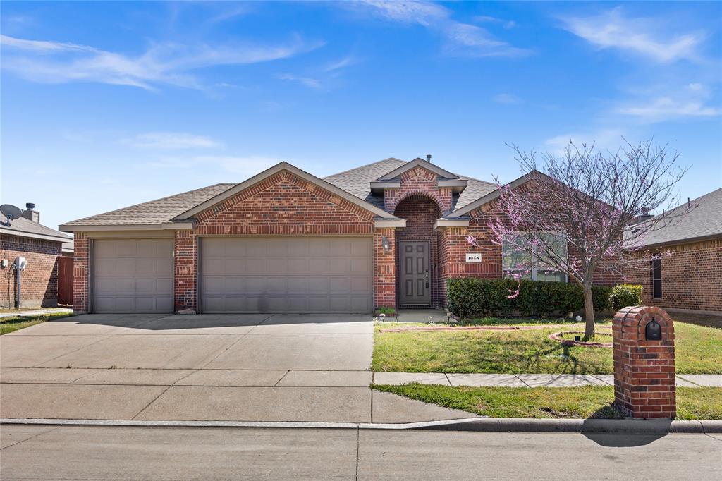 Welcome to this charming 3-bedroom, 2-bathroom home located in the highly desirable Grand Heritage community in Lavon. This well-maintained residence offers an inviting open-concept layout, perfect for both everyday living and entertaining. The spacious living area features a cozy fireplace, creating a warm and welcoming atmosphere.
The kitchen seamlessly flows into the dining and living spaces, enhancing functionality and comfort. A standout feature of this home is the oversized attached 3-car garage, providing ample space for vehicles, storage, or a workshop.
Step outside to enjoy the large, fully fenced backyard complete with a patio—ideal for relaxing evenings or hosting family and friends.
Recent updates include a durable 3-ply roof replaced in 2016 and a water heater updated in December 2020, offering added peace of mind.
Located in a vibrant community with amenities and convenient access to nearby schools, shopping, and dining, this home truly has it all. Don’t miss your opportunity to make it yours!