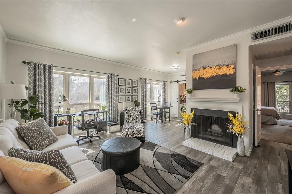 Experience elevated living in this beautifully maintained condo offering breathtaking views of the Trinity River and an unbeatable location in the heart of Fort Worth and minutes from TCU. Natural light fills the open-concept living and dining areas, creating a warm, inviting atmosphere perfect for both relaxing evenings and entertaining guests. Large, updated windows frame stunning river views while enhancing energy efficiency and comfort. The thoughtfully designed kitchen features ample cabinetry, generous counter space, and a functional layout that flows seamlessly into the main living area. The spacious primary suite offers comfort and privacy and showcases a beautiful custom accent wall, along with two large walk-in closets providing exceptional storage and organization. Assigned covered parking is conveniently located just steps from the stairs leading to the private patio, making everyday living easy and accessible. Residents appreciate secure access, well-kept common areas, and the peace of mind of living within a gated community, all while enjoying the convenience of low-maintenance living. Step outside and enjoy a short walk to the scenic Trinity Trails, nearby parks, and endless opportunities for outdoor recreation. The property is also within walking distance to Tanglewood Elementary, as well as popular grocery stores and a wide variety of local restaurants, making this an ideal blend of comfort, style, and prime location.