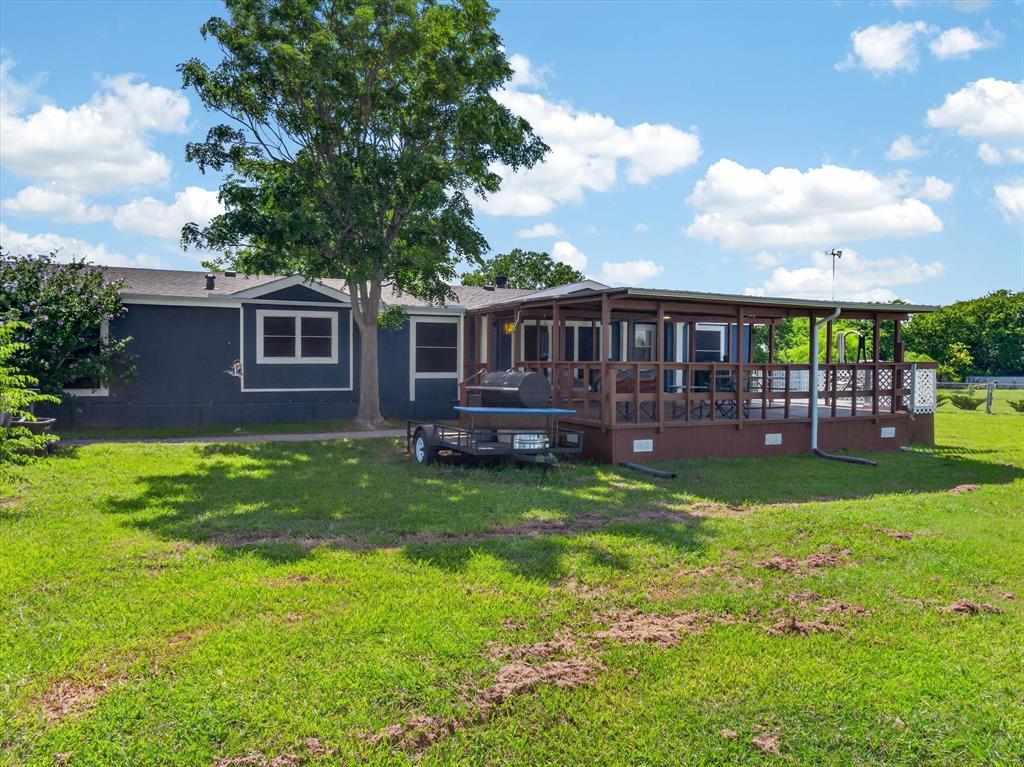 Move-In Ready on 1 Acre in Sanger, TX! This beautifully maintained 4 bedroom, 2.5 bath manufactured home offers 2,016 square feet of comfortable living with room to spread out both inside and out. Situated on a full acre, this property features two spacious living areas, an updated kitchen, and a thoughtful layout designed for everyday living and entertaining. Recent improvements include a new roof, fresh paint, and a new garden tub in the primary bathroom, adding value and peace of mind for the next owner. Pride of ownership shines throughout, as the current owner has completed the maintenance and handyman projects needed to make this home truly move-in ready. Enjoy the flexibility of country living with plenty of  outdoor space for gardening, pets, hobbies, or simply relaxing under the Texas sky. Carport with attached storage building for all your storage needs along with plenty of additional parking space. The large covered front porch provides the perfect spot to unwind and take in the peaceful surroundings. If you're looking for an affordable property with space, updates, and a turnkey feel just minutes from Sanger conveniences, this one is a must-see!