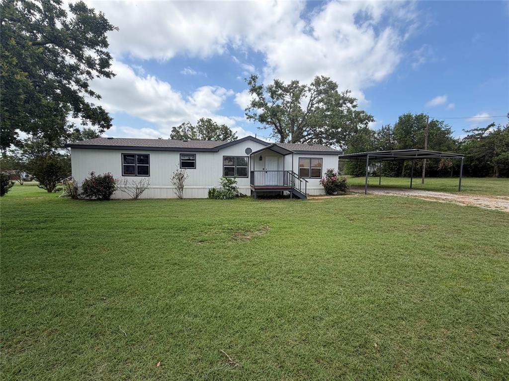 Come check out this Beautiful house on a large 1 acre corner lot in a nice neighborhood. Recently updated with new carpet, new interior and exterior paint, resurfaced kitchen countertops, new electric fireplace, all in June 2026. Large open kitchen with an island, walk in pantry. Large Master bath with walk in closet. New skirting around the home. Metal framed covered porch and (2) car parking awning. Brand New Roof.  Has a certified permanent foundation.  Close to Springtown schools. Should qualify for most loans.