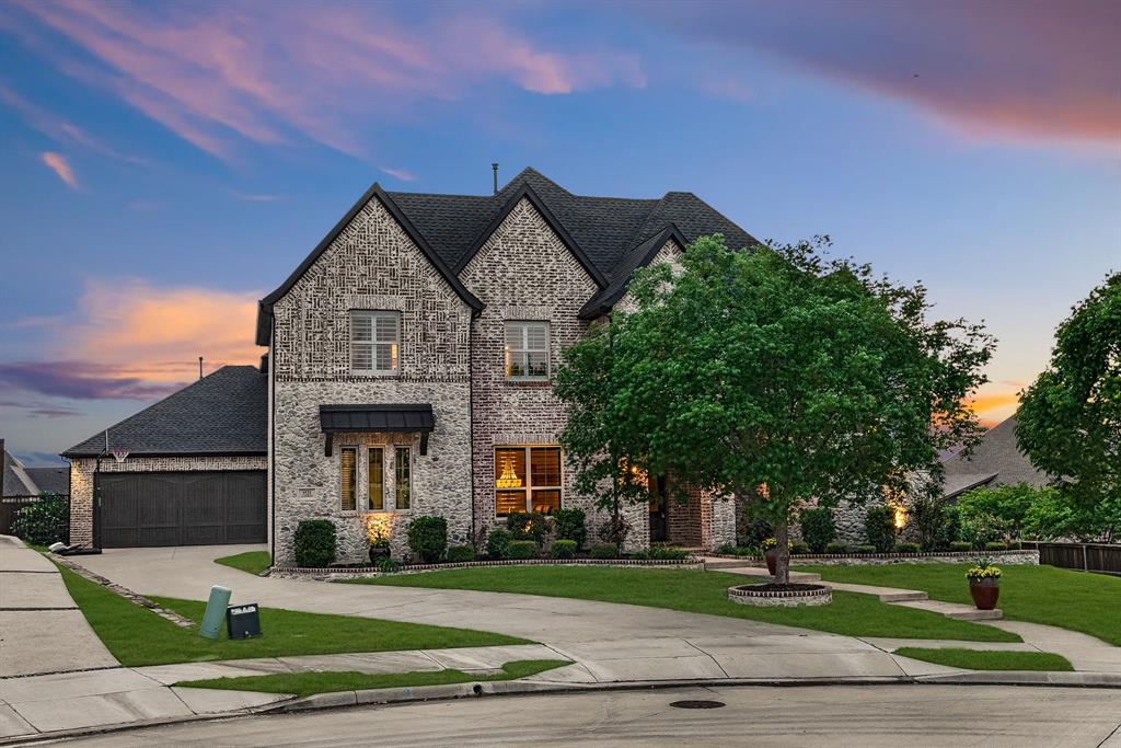 Perched on a premier cul-de-sac at one of the highest elevations in Prosper, 1521 Latigo Court is a rare opportunity to own a Jeff Pfeifer custom home that seamlessly blends luxury design, privacy, and resort-style living. Situated on an oversized nearly half-acre lot in Prosper, Texas, this exceptional 5-bedroom, 6-bath estate delivers the elevated lifestyle today’s luxury buyers are searching for.
Designed for both everyday living and high-level entertaining, the heart of the home is a true chef’s kitchen featuring expansive prep space, premium finishes, and effortless flow into the main living and dining areas—ideal for hosting and gathering.
Step outside and experience a private backyard retreat that rivals a luxury resort. The resort-style pool, expansive outdoor living spaces, and custom outdoor kitchen with vented hood are complemented by a beautifully designed outdoor cabana, creating the ultimate setting for entertaining in North Texas year-round. The oversized homesite offers space, privacy, and presence—an increasingly rare find in Prosper.
Inside, the home continues to impress with a dedicated game and entertainment room featuring a built-in bar, perfect for hosting guests, watching games, or relaxing in style. A private balcony overlooking the backyard provides sweeping views from one of the highest vantage points in the area—an unforgettable feature that sets this home apart.Located in one of Prosper’s most desirable communities and positioned on a quiet cul-de-sac, this home offers the perfect balance of exclusivity and convenience, with easy access to top-rated Prosper ISD schools, shopping, dining, and nearby luxury developments.
Luxury homes in Prosper with this level of customization, lot size, elevation, and outdoor living are limited.

1521 Latigo Court is more than a home—it’s a statement.