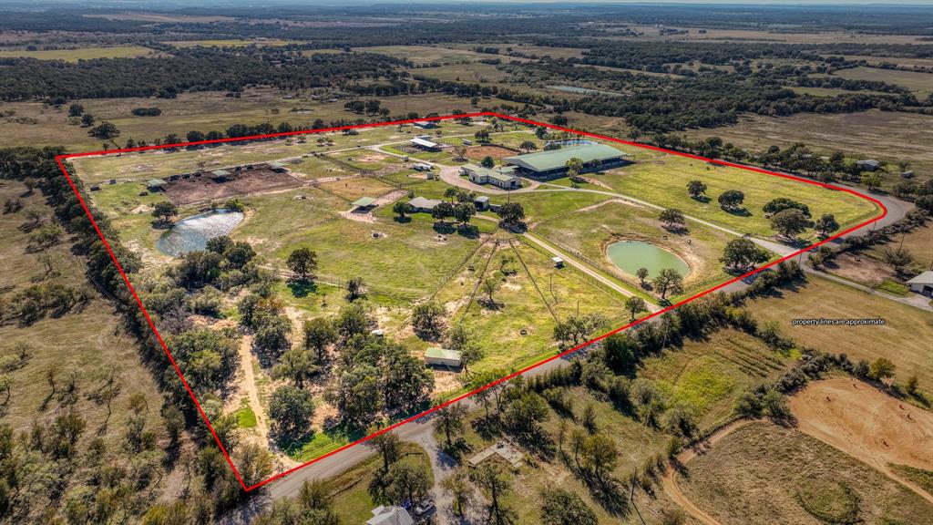 THIS INCREDIBLE TURN KEY SHOWPLACE IS MOVE IN READY FOR ANY TRAINING OR BREEDING OPERATION. SET UP TO ACCOMIDATE CUTTING, REINING OR ROPING AND ANYTHING IN BETWEEN, THIS IMMACULATE SHOW BARN IS CONNECTED TO THE 125 X 250 COVERED ARENA WITH HOLDING PENS AT BOTH ENDS. ABSOLUTELY EVERYTHIG YOU NE TO MOVE IN AND GO!! REMODLED FOREMANS HOUSE OVERLOOKS THE RANCH WITH A 2YEAR OLD MODULAR 3BED 2 BATH BOUGHT NEW. PLUS, A THIRD HOME. MARE MOTEL, LOAFING SHEDS AND CATTLE HOLDING FACILITIES. A MUST SEE FOR THOSE WHO ARE SERIOUS ABOUT THEIR FACILITY!!
