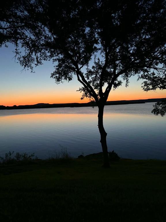 Tucked away on a quieter, less congested area of Possum Kingdom Lake, this beautifully maintained second-level condo offers the perfect balance of relaxation, privacy, and lake living. Situated in deep water, this property is ideal for enjoying the peaceful side of PK on the Peninsula while still having convenient access to everything the lake has to offer.

The second-level location provides added privacy and security, while also offering practical benefits for owners with pets or children by keeping the space more protected from weather and foot traffic. Whether you are looking for a weekend escape or a low-maintenance lake retreat, this condo offers a comfortable, inviting atmosphere designed for easy lake living.

Inside, you’ll find a bright, welcoming space with an open layout, tasteful décor, and select furnishings included, making it easy to start enjoying the property right away. The cozy living spaces, natural light, and relaxing lake feel create the perfect setting for mornings with coffee, weekends on the water, or peaceful evenings after a day at the lake. 

This property includes a courtesy dock, boat dock, swimming pool, and large recreation areas for games and casual walks.  Just minutes away from walking, hiking, and biking trails. 

Located in one of Possum Kingdom’s most desirable waterfront communities, this condo offers the charm of lake life without the maintenance demands of a larger property. Enjoy the convenience, comfort, and laid-back lifestyle that make PK such a sought-after destination.