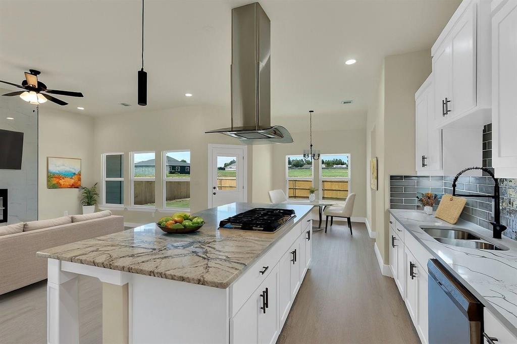 Newly Constructed Modern Home w Architectural Details! Beautifully crafted for modern living! 4 spacious bedrooms & 2 full baths, this home offers ample space for families to grow. The living room creates a warm, welcoming atmosphere, featuring a stunning floor-to-ceiling marble fireplace. The kitchen is a chef’s dream, complete w a massive quartz island & eating bar, gas cooktop w a decorative vent hood, & stylish pendant lighting. Stainless steel appliances, a farmhouse sink, decorative cabinet pulls, and abundant cabinetry provide both functionality and elegance. Additional highlights include a large utility room w a built-in sink & cabinetry, luxury vinyl plank flooring, & soaring 10-foot ceilings throughout. Primary Bedroom & Ensuite bath has large tub w separate shower. Custom walk in closet. Outside, enjoy a covered patio, fully fenced backyard, and sprinkler system to keep your landscape lush. Move in and enjoy every thoughtfully designed detail in this stunning home! Convenient commute to DFW. Award winning Palmer ISD! There are other homes available now take a tour today of Copper Penny Estates. Total community will have 35 homes when completed!