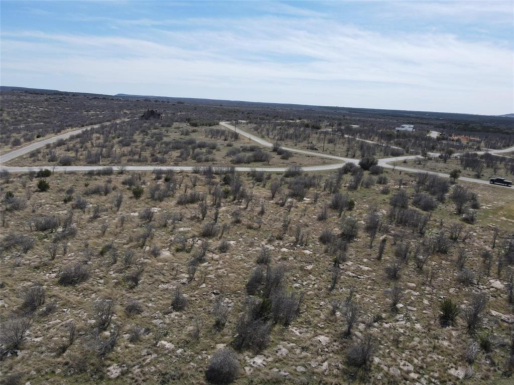 Situated in a gated community just minutes from Possum Kingdom Lake, this stunning property is ready for your dream home. Enjoy breathtaking views, a serene setting, and top-tier amenities, including 56 complementary rounds of golf per year, two pools, tennis courts, a restaurant, a fitness center, and more! With no timeline to build and the freedom to choose your own builder, this is an opportunity you don’t want to miss!