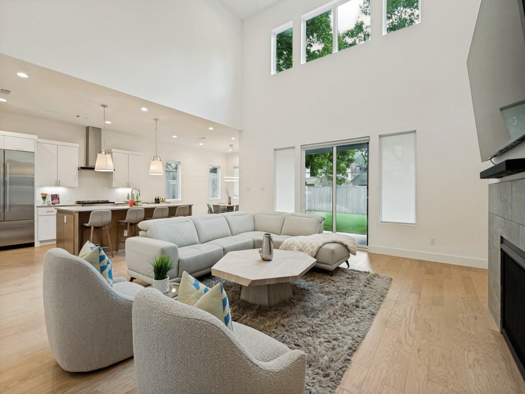 Sophisticated luxury living in one of Dallas’ most desirable locations, this beautifully designed five-bedroom, four-bath residence combines timeless style, thoughtful craftsmanship, and modern functionality. The impressive exterior features limestone, stucco, painted lap siding, and oversized casement windows that create striking curb appeal. Inside, a grand two-story foyer and sweeping staircase introduce spacious living areas designed for both everyday comfort and entertaining. The first floor offers a private study, formal dining room, elegant powder bath, and an expansive living area with soaring ceilings and a fireplace that flows seamlessly into the kitchen and breakfast area. The kitchen is equipped with JennAir stainless steel appliances, a six-burner gas cooktop, a large center island, abundant cabinetry, designer finishes, and an open-concept layout overlooking the covered outdoor living space and backyard. Tucked away on the main level, the primary suite provides a peaceful retreat with views of the backyard and a well-appointed ensuite bath. Upstairs, you'll find generously sized secondary bedrooms, an additional living area, and a flexible fifth bedroom that can serve as a media room, game room, home gym, guest suite, or office. Wide-plank engineered hardwood flooring, solid-core interior doors, premium plumbing fixtures, designer lighting selections, and quality finishes can be found throughout the home. Conveniently located near a variety of shopping, dining, parks, and private school options, including The Episcopal School of Dallas, The Lamplighter School, Ursuline Academy of Dallas, The Hockaday School, and St. Mark’s School of Texas, this property offers an exceptional opportunity to enjoy comfort, convenience, and modern living in a sought-after Dallas location.
