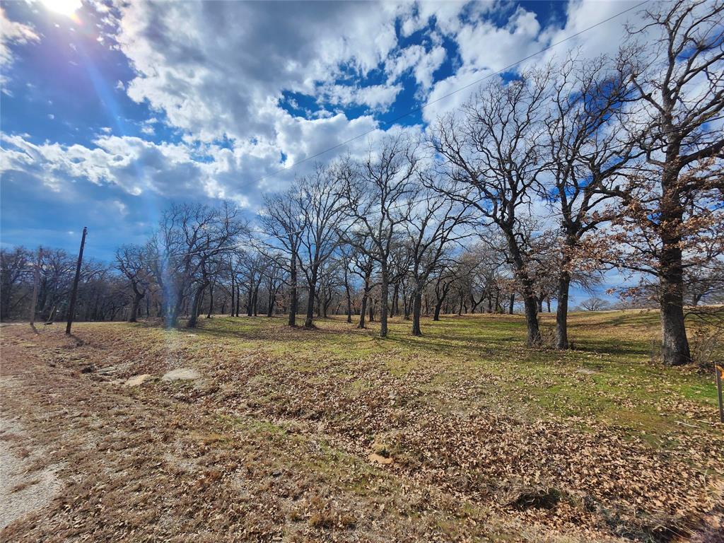 Golfers paradise, beautiful build site on hole 16 on golf course. Property is 4 lots combined with a total of 1.18 acres. Has plenty of shade with mature oak trees. Perfect combination of country life and private golf course community. lots are surrounded by the tranquility of nature as you will often see deer all around the property. Nocona Hills offers a 24-hour guarded gated community with access to two private lakes (one listed as top 5 Bass fishing in Texas)a community boat ramp and dock, as well as an 18-hole golf course with driving range, an airstrip, campgrounds with RV sites, and more. Utilities include co-op water and electric already at street. Fiber optic high speed internet is also available. Nearby surroundings include historic downtown Nocona, a winery, brewery and just a short drive to Saint Jo, Muenster and popular Casinos. Also have 2 adjacent lots available totaling .53 acres that can be added to the property in a combined bundle. Owner has multiple lots available to choose from, please contact listing agent for details. The Club house is under remodel along with the pool such an exciting new Update for the community.