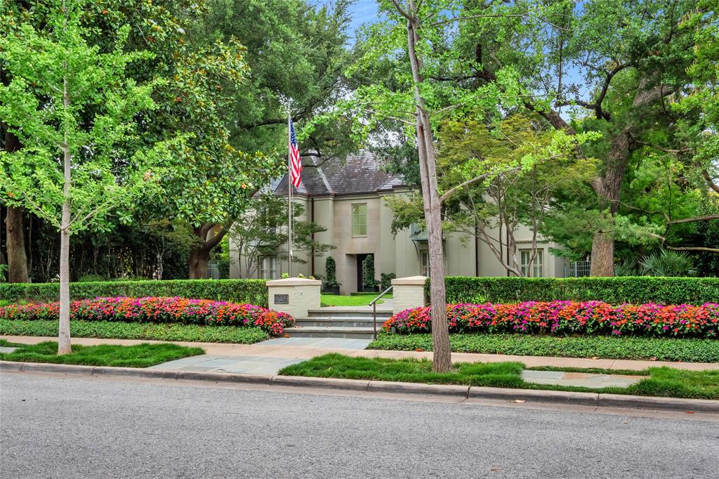 This Highland Park home is a rare gem on the highly sought-after estate block of Gillon Avenue - the very first property adjacent to Lakeside Drive and Exall Lake on Turtle Creek. Sitting on 0.437 acres, it boasts 96 feet of frontage framed by mature trees and meticulous landscaping. Remodeled by JK Boone, this residence showcases exquisite flooring, custom millwork, and incredible art walls. A unique feature is the dual primary suite layout, one that offers a private terrace overlooking the serene rear grounds. High ceilings and generous room proportions create an inviting ambiance. Outside, a beautifully landscaped yard includes an outdoor living area with a fireplace in addition to the pool area with Pennsylvania stone hardscaping, a fountain, and a commercial pizza oven. Above the detached two-car garage is a 464 square-foot guest suite or quarters with elevator access. This property combines impeccable craftsmanship with a sterling location making it an incredible opportunity to utilize the existing home and improvements, or embark on a new chapter using the commanding street presence and exceptional location.