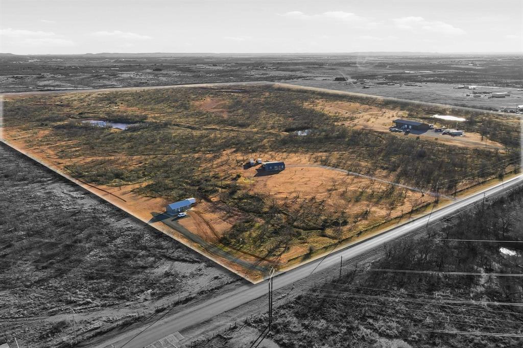 67+ Acre Industrial Development Opportunity – Abilene, TX
Located just outside Abilene within the City of Abilene’s Extra-Territorial Jurisdiction (ETJ), this expansive 67+ acre property offers a rare opportunity for industrial, energy, or technology-driven development. The site is well-suited for clean energy projects, data centers, or large-scale industrial facilities, and is positioned in a growing industrial and tech corridor.
Property Features:
Utilities in Place: Water and electrical connections on-site, with heavy industrial power nearby. 
Multiple Improvements:
Main residence: 1,873.8 sq ft
Porch: 1,080 sq ft
Shop: 2,349 sq ft
RV room: 1,080 sq ft. 
Additional residences:
6485 Summerhill, 6487 Summerhill, 6529 Summerhill all included! 
Existing structures are ideal for construction offices, operational headquarters, or employee housing.
Resource Availability:
Gravel on-site for road construction or site development. 
Two large water tanks available for dirt work and development use
!Survey available!
Strategic Location:
Convenient access to Interstate 20, Highway 277, and FM 2404
Excellent connectivity for transportation, logistics, and industrial operations
With its size, infrastructure, resources, and strategic location, this property presents an outstanding investment opportunity in one of Abilene’s most promising growth areas. Don’t miss the opportunity to invest.