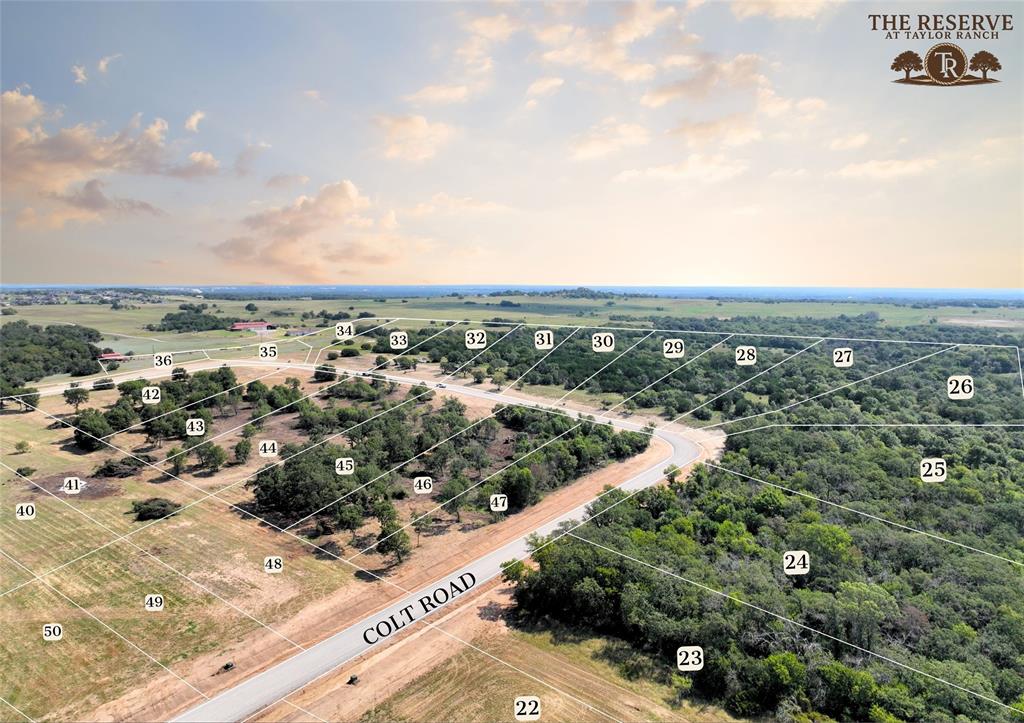Welcome to The Reserve at Taylor Ranch, Your Private Slice of Parker County Paradise. This lot has been selectively cleared offering elevated views. This is one of the most pristine lots, sitting atop the neighborhood and overlooking the blank hills. Turn key, fully excavated, and ready for your build project! Nestled in the quiet countryside of Springtown and within the coveted Weatherford ISD, offering a rare opportunity to own acreage tracts that balance privacy, beauty, and freedom, all just minutes from town. Ranging from hilltop parcels with sweeping views to shaded, wooded retreats;  each one unique and full of potential. With rolling topography that rises nearly 90 feet, the backdrop is breathtaking, offering unforgettable Parker County sunsets and a peaceful rhythm of life that feels miles away from the noise, yet only 20–25 minutes from Weatherford and close to Springtown’s local dining, shopping, & amenities. The Reserve is a true escape, a neighborhood that prioritizes privacy, space, & quality. Build your dream home on your timeline with deed restrictions, no HOA, and the freedom to create a lifestyle that suits you. Enjoy underground electricity, no water bills, well and septic-ready lots, & Next Link Fiber Optic Connectivity, all while being nestled in a quiet community. It’s the kind of place where neighbors wave, stars shine brighter, and the land works with you, not against you. The Reserve at Taylor Ranch isn’t just a place to live, it’s a place to belong. Evenings here feel like stepping back in time, where you can wander under wide Texas skies, catch lightning bugs in the dusk, and enjoy the kind of quiet that lets you hear the breeze through the trees. This is your invitation to slow down, spread out, and savor the simple moments. Come walk the lots, take in the views, and imagine the possibilities. New single-family construction must have a minimum of 1,700 square feet. No Barndominiums.