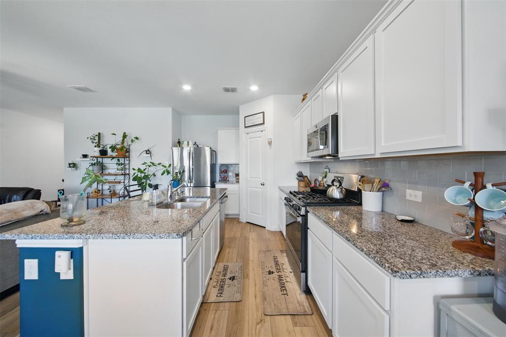 Stunning 1-Story Home In Like New Condition! There Are A Lot Of Bonus Features In This Home Including Luxury Vinyl Plank Flooring Throughout And A Light And Bright Color Palette That Creates A Welcoming Atmosphere. Fabulous Open Floorplan Seamlessly Connects The Living, Dining, And Kitchen Areas, Making It Perfect For Entertaining Or Family Gatherings. Speaking Of Kitchens....The Spacious Kitchen Is A Chef’s Dream, Boasting An Extended Island Complete With Breakfast Seating, Gorgeous Granite Countertops, Gas Cooking, And Sleek Stainless Steel Appliances Plus A Large Walk-In Pantry. The Secondary Bedrooms Are Incredibly Spacious, Offering Ample Space For Family Or Guests. This Home Also Features A Significant Amount Of Storage From The Large Walk-In Master Bedroom Closet To The Linnen Closet And Even Good Size Secondary Bedroom Closet Space. Step Outside To The Beautiful Covered Patio, Overlooking A Serene Backyard, The Perfect Retreat For Outdoor Relaxation Or Entertainment. This Home Truly Offers Comfort, Style, And Functionality For Modern Living.