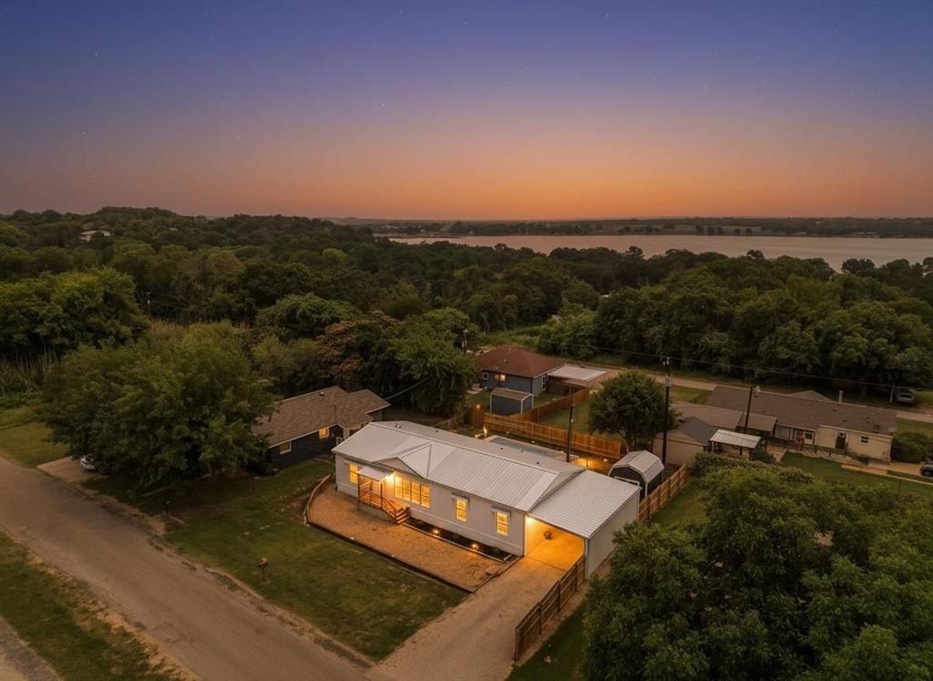 Come see this beautifully updated newer home featuring an impressive list of upgrades throughout. Inside, you’ll find stylish cabinetry, a built-in entertainment center, designer lighting and fixtures, updated carpet and luxury vinyl plank flooring, along with custom window coverings that add warmth and character to the space. The striking metal roof adds both durability and curb appeal.

The thoughtfully designed floorplan includes a designated office space and an oversized laundry room complete with a sink and additional space for a freezer or second refrigerator. Outside, the property continues to impress with a newer 10x12 storage shed and a spacious 14x28 carport offering plenty of extra storage and parking options.

The subdivision offers access to a community swimming pool and park amenities. Enjoy added privacy with no neighbors directly across the street or behind the home thanks to the park just across the road. Refrigerator, washer, and dryer are all included, making this home truly move-in ready.