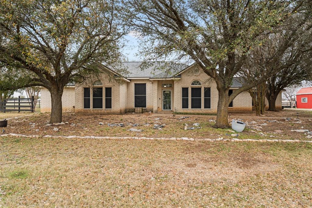 Escape to the perfect blend of country living and modern comfort with this beautiful 4-bedroom, 3-bath Austin stone home situated on 5 fully fenced acres. Offering privacy, space, and versatility, this property is ideal for families, hobby farmers, or anyone looking for room to spread out while still being within easy reach of nearby amenities. Inside, the home features spacious, light-filled living areas accented with stone details and a functional open layout designed for everyday living and entertaining. A dedicated home office provides the perfect space for remote work, study, or a flex room. The kitchen offers ample counter space and cabinetry, making it both practical and welcoming for gatherings. Recent upgrades include two water heaters, central HVAC units, and a roof all approximately two years old, providing peace of mind for the next owner. Step outside to enjoy a private backyard retreat complete with a covered patio and relaxing hot tub, perfect for unwinding or hosting friends and family. The property also includes a detached shop workshop and a barn, offering excellent space for equipment, hobbies, animals, or storage. The fully fenced and cross-fenced acreage is ready for livestock, pets, or pasture use, while mature trees and open space create a peaceful country setting.
This property offers the best of rural charm with comfortable, move-in-ready living.