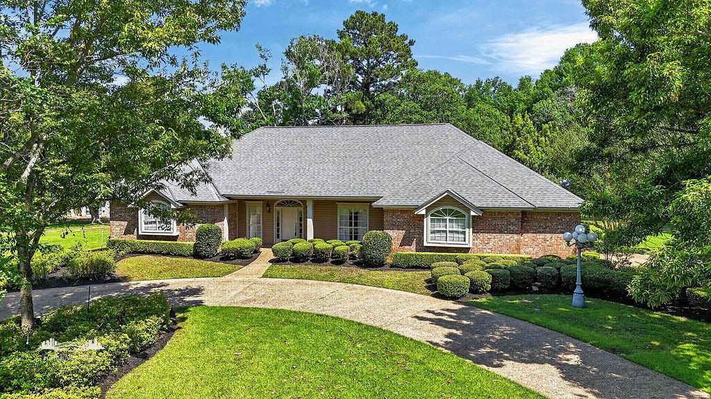 Nestled in a tranquil neighborhood, this 4-bedroom, 3.5 bathroom home offers spacious rooms with plenty of storage promising comfort at every turn. The updated kitchen with granite countertops is a culinary haven which flows seamlessly into the dining and living areas making it perfect for entertaining and everyday living.  
The primary bath serving as a spa-like retreat with a deep soaking tub and separate walk-in shower designed for the ultimate relaxation. 
Outside the property continues to impress with its extra-large patio perfect for al fresco dining or simply unwinding while enjoying the serenity of the
lush surroundings.   
The driveway leads all the way down to a shop with an overhead door on the back.