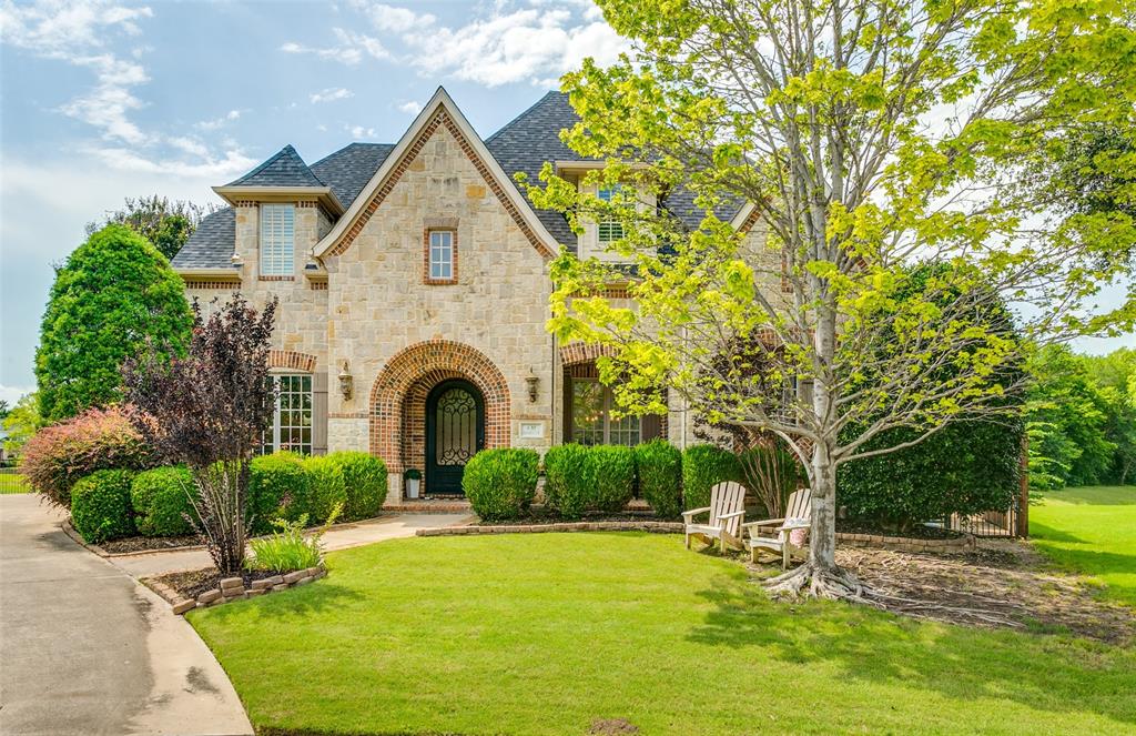 Nestled on a secluded cul-de-sac in one of Coppell's most desirable locations, this spacious and updated custom home offers exceptional craftsmanship and breathtaking views at every turn. From the moment you enter through the wrought-iron front door, you'll be captivated by soaring ceilings, walls of windows, custom built-ins and a highly functional floor plan designed for both everyday living and entertaining. Recent updates include cabinetry, paint and flooring throughout, creating a sophisticated feel. The heart of the home is the family room and chef's kitchen, both showcasing panoramic views of the resort-style backyard, pool, tranquil ponds, and lush green space beyond. The updated kitchen is perfectly equipped for everything from casual family meals to large gatherings, featuring a six-burner gas range, built-in refrigerator, oversized pantry, and additional appliance garage with pull-out drawers. Entertaining is effortless with a coffee or wine bar, butler's pantry, spacious formal dining room, and 2 conveniently located powder baths. The private primary suite is a true retreat, offering direct patio access, picturesque views and a spa-inspired bath with a soaking tub, oversized walk-in shower, dual vanities and a generous walk-in closet. Upstairs, 4 additional bedrooms provide excellent access to updated full baths, while a media room, gamerm, and kitchenette create the ultimate entertainment level for family and guests. Step outside to an extraordinary backyard oasis overlooking two scenic ponds, mature trees, and expansive open space. Enjoy outdoor living with a sparkling pool and spa, built-in grilling station, screened patio with fireplace, and incredible views in every direction. Additional highlights include a private office with built-ins, abundant storage throughout, and a three-car garage. Ideally located in the heart of Coppell and zoned to highly acclaimed Coppell ISD, this exceptional property offers luxury, privacy, and an unmatched lifestyle.