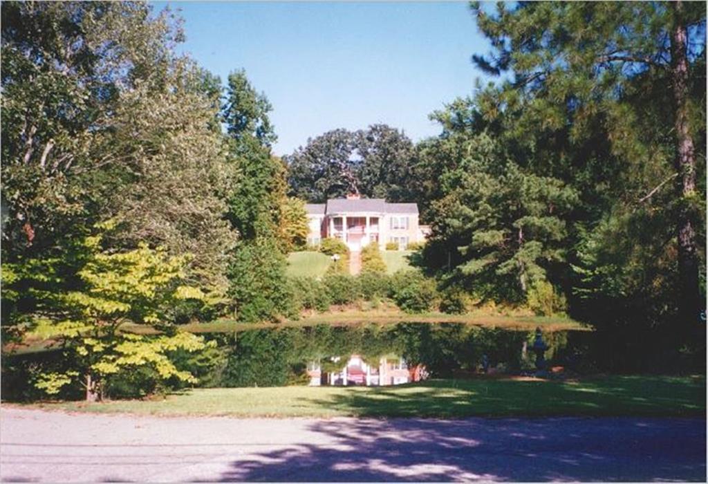 Once upon a time, in historic Tyler Texas, a home was built in a most picturesque storybook setting. Known as Chapman’s Anchor, prepare to be transported to a peace filled place among mature oaks, magnolias, azaleas & dogwoods. Stone retaining walls & landscaped flower beds flank the long circle drive & tree shaded spring fed pond leading to the exceptional home on the hill. Built in 1967 with 2936 sq. ft., this was a perfect family home with 4 bedrooms, 3 baths, 2 living areas & formal dining room. A private pool and pool house, complete with living-dining-kitchen, 2 bedrooms & 2 baths, was built to complete the property and provide everything a family could enjoy. Entertaining was easy here - and children played with their friends on this private 2.89 acre tract in the very heart of Tyler. Years have passed and the home and pool house have fallen into disrepair but the grounds & views are still breathtaking. THIS is the perfect setting for the home of your dreams, conveniently located south of downtown & inside Loop 323, near shopping and medical facilities. And a real bonus is that the guest house could be updated to live in onsite while your home is being built! Or the home could be updated and restored to its original glory. A fountain could be added to the pond, providing relaxing sounds plus a filtration system to deter algae growth without harming the fish and wildlife. Duck families lived here for years while sellers were inhabiting the home and would return again. This is the perfect setting to make your dreams come true!